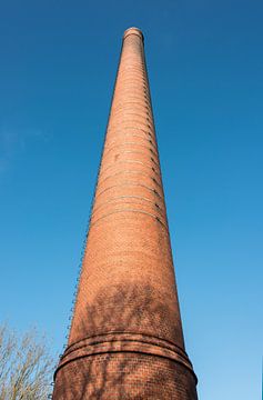 high chimney at blue sky