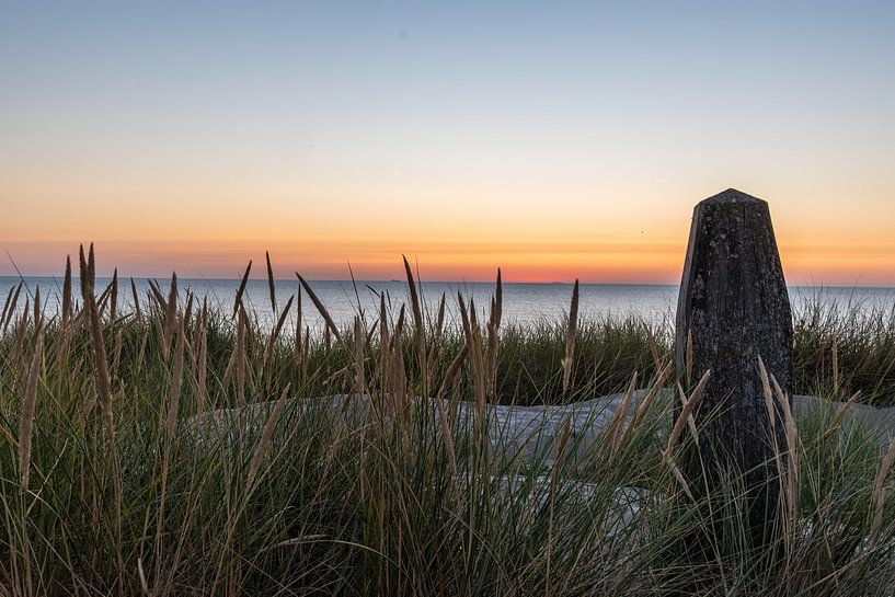 Texel sunset pole 17 by Lies Bakker