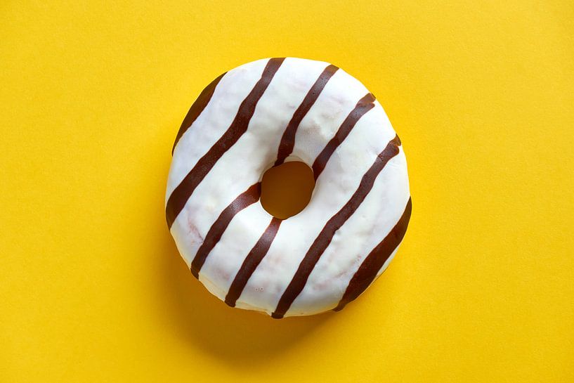Donut on yellow by Harry Wedzinga