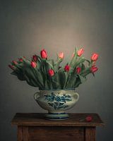 Red tulips in a Delft Blue vase