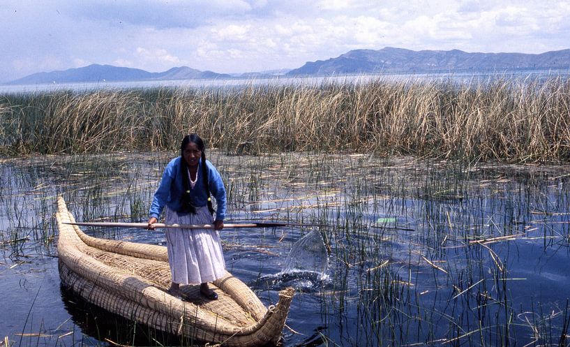 Beautiful uro lady with her special boat, typical of Lake Titicaca by Ignacio Genzo