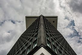 The tower of Amsterdam North into the cloudy sky. by Zaankanteropavontuur