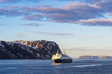 Mountains, rocks and ships in winter near Havøysund in Norway by Rico Ködder