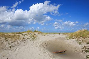 Dunes, sand, blue sky and clouds on Ameland beach