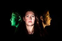 Face of a young woman frontally and in profile multicoloured
