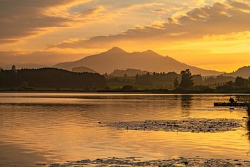 Sunset over Hopfensee lake with view of Alpspitze mountain by Leo Schindzielorz
