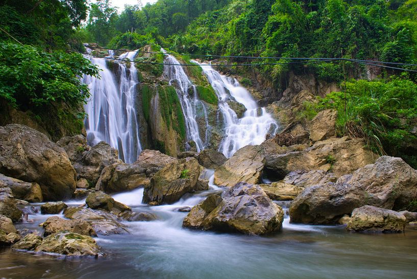 Rocks in front of a waterfall by Bart Nikkels