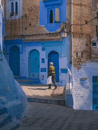 A man walking in Chefchaouen by Lizet Wesselman