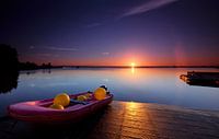 A small red boat full of colored buoys at dawn by Jef Folkerts thumbnail