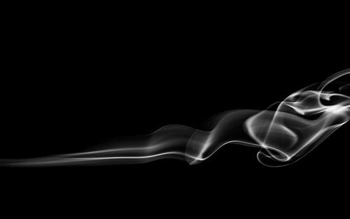 black and white image of smoke on a black background radiating tranquillity