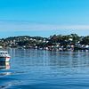 View of the town of Arendal with boat in Norway by Rico Ködder