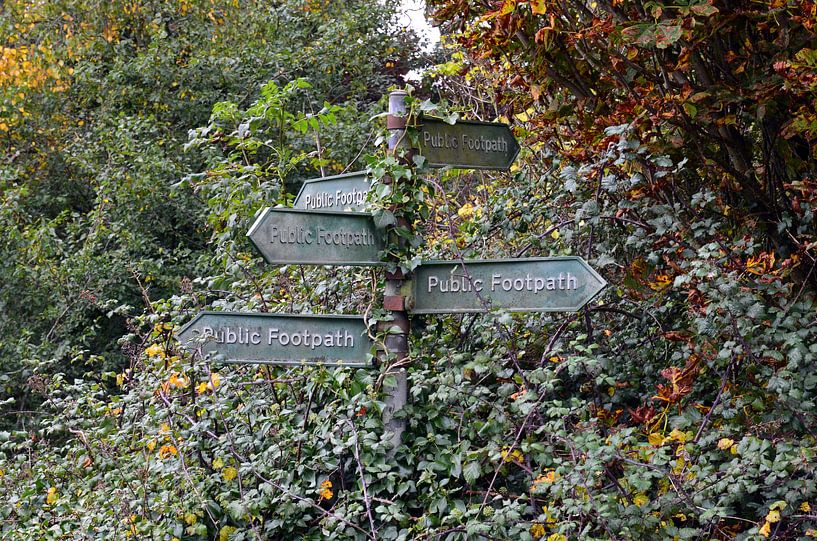 Comic signpost for walking routes in the Cotswolds countryside in England by Gert Bunt