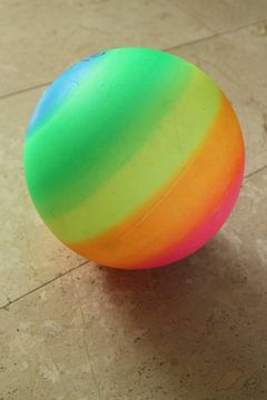 Toy ball against light background