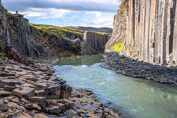 Basalt columns coloured orange by iron oxide, Studlagil Canyon, Egilsstadir, Austurland, Iceland