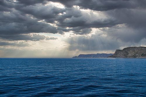 Western Cape in Norway. Fjord and sea with clouds and mountains on the coast