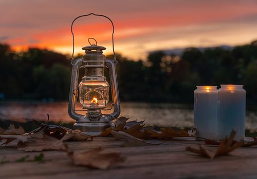 Fire hand with candles in autumn