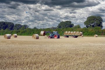 Driving in straw on the Lower Rhine before the rain comes by Peter Eckert
