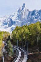 Railroad tracks for snow-covered mountain peak