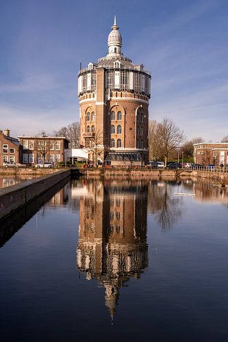Reflection of historic water tower in a district of Rotterdam, the Netherlands