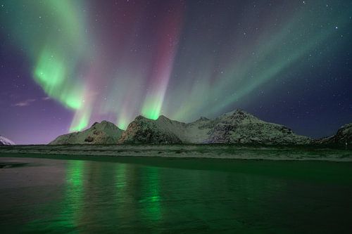 Green and red auroras over Norway