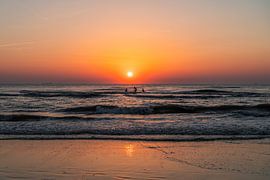 Surfers on the beach at Noordwijk during a sunset (0072) by Reezyard