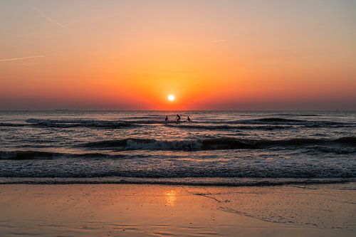 Surfers on the beach at Noordwijk during a sunset (0072)