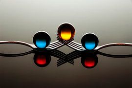 marbles and two forks. by Gerhard de Wit