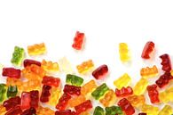 colorful fruit gum candy bears isolated with small shadow on white as a background frame, can be use by Maren Winter thumbnail