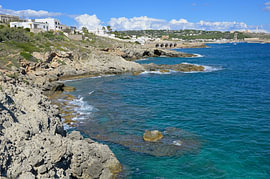 The rocky coastline of Santa Maria di Leuca with its clear, turquoise sea by Tomherkules