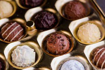 Chocolate truffles in gold box by C. Nass