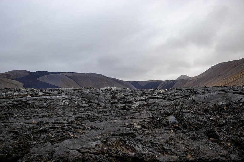 Lava up close with volcano in the background in Iceland | Travel photography by Kelsey van den Bosch