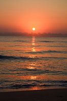 Zonsondergang aan zee