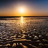 Colorful Sunset by the Sea with sand waves in the foreground by Jan Hermsen