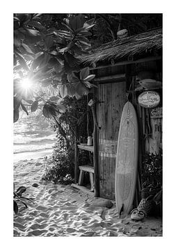 Surfboard at a rustic beach hut at sunset by Felix Brönnimann