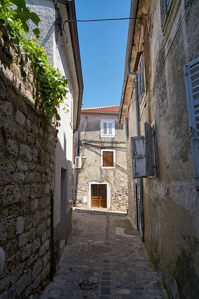deserted alley in the historical old town of Krk by Heiko Kueverling