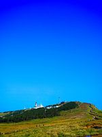 Blue sky above lighthouse