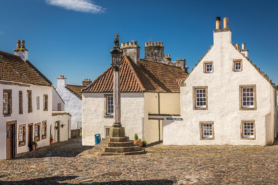Historic market square with market cross in the village of Culross by ...