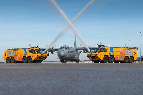 E-one fire trucks with a C-130 Hercules transport aircraft