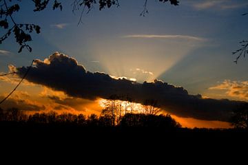 Sunset behind the clouds