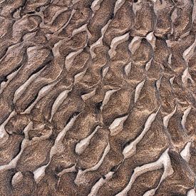 Abstract pattern in the sand of the beach by Lisette Rijkers