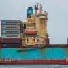Een containerschip nadert de haven van scheepskijkerhavenfotografie