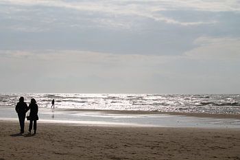 A walk on the beach at sunset.