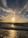 Setting sun. The light reflects so nicely on the water. The waves give it a playful look by Wendy Hilberath thumbnail