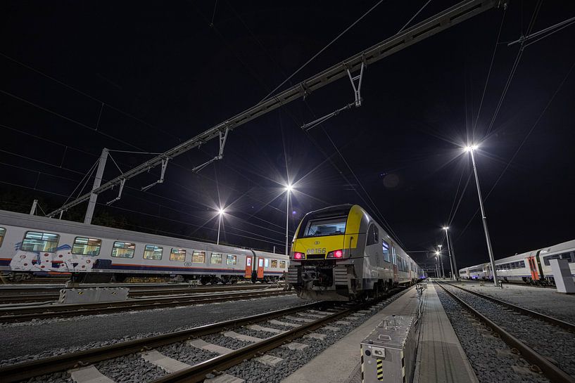 light beams above the trains by Siebe Taeleman