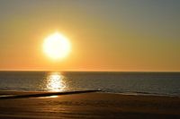 Zonsondergang aan zee