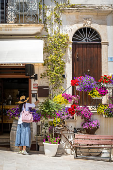 Charming Italy: A Colourful Façade Adorned with Flowers