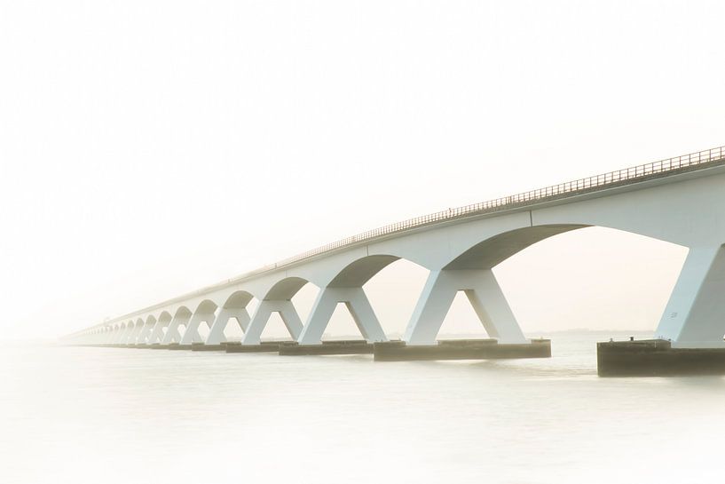 Zeeland Bridge in the mist, Zeeland Netherlands. by Gert Hilbink