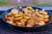 Roast potatoes from the campfire