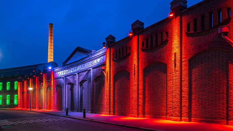 Old factory wall illuminated by Noud de Greef