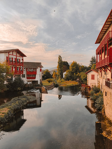 Red balconies overlooking the still river